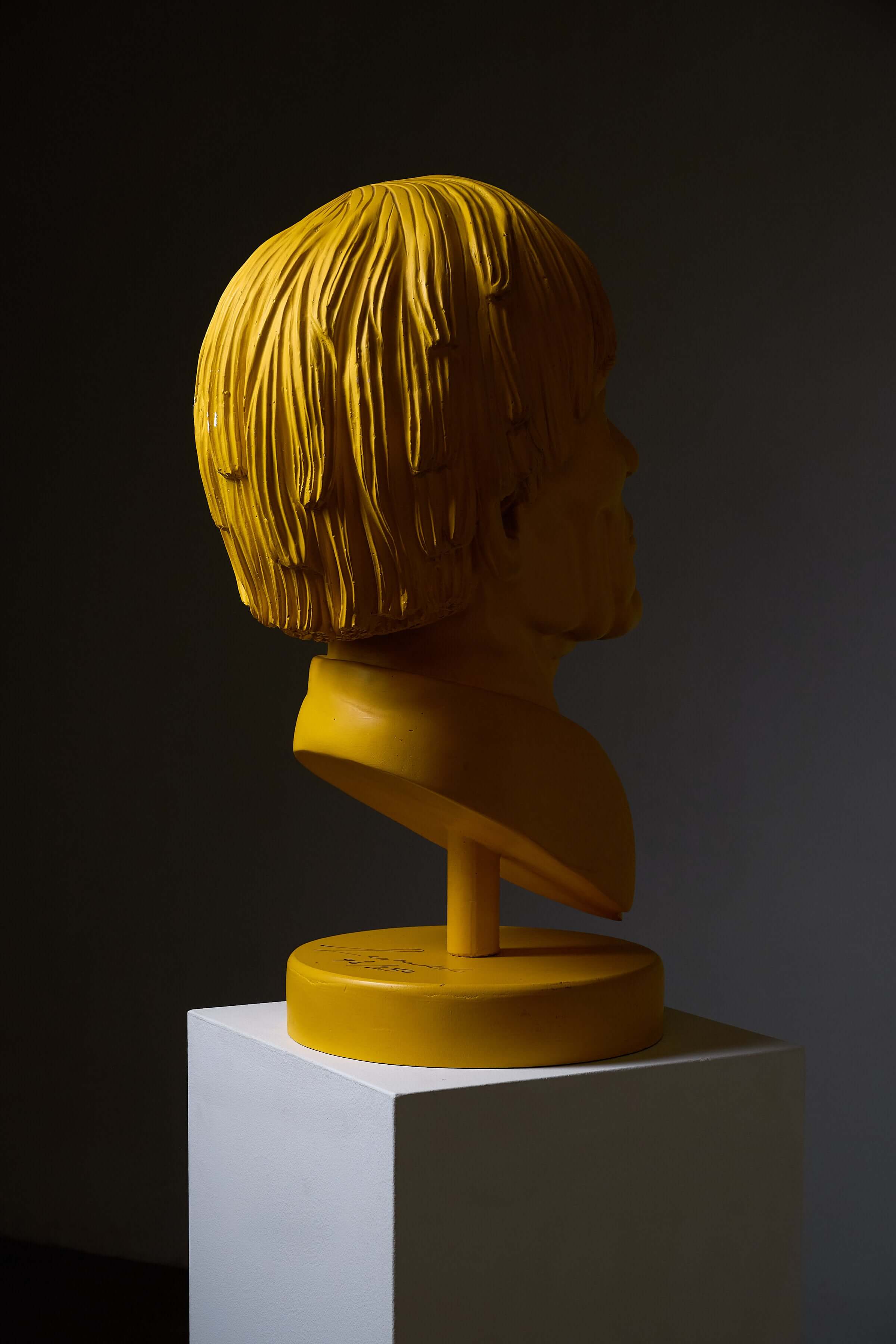 Andy Warhol' Sculpture by Leonardo, a yellow bust depicting the Pop Art icon.