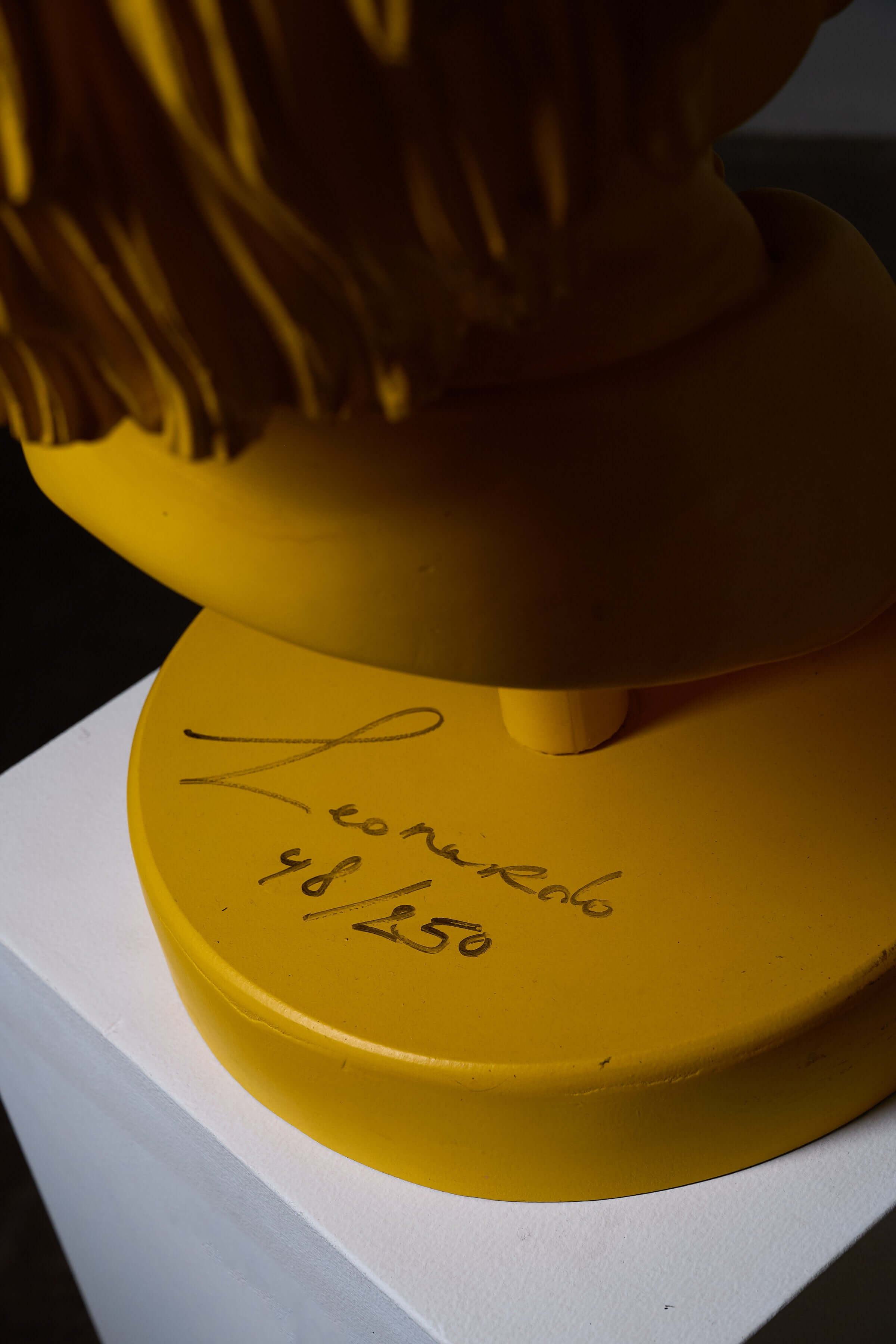 Close-up of 'Andy Warhol' Sculpture by Leonardo, featuring signature and edition number 48/250 on the base.
