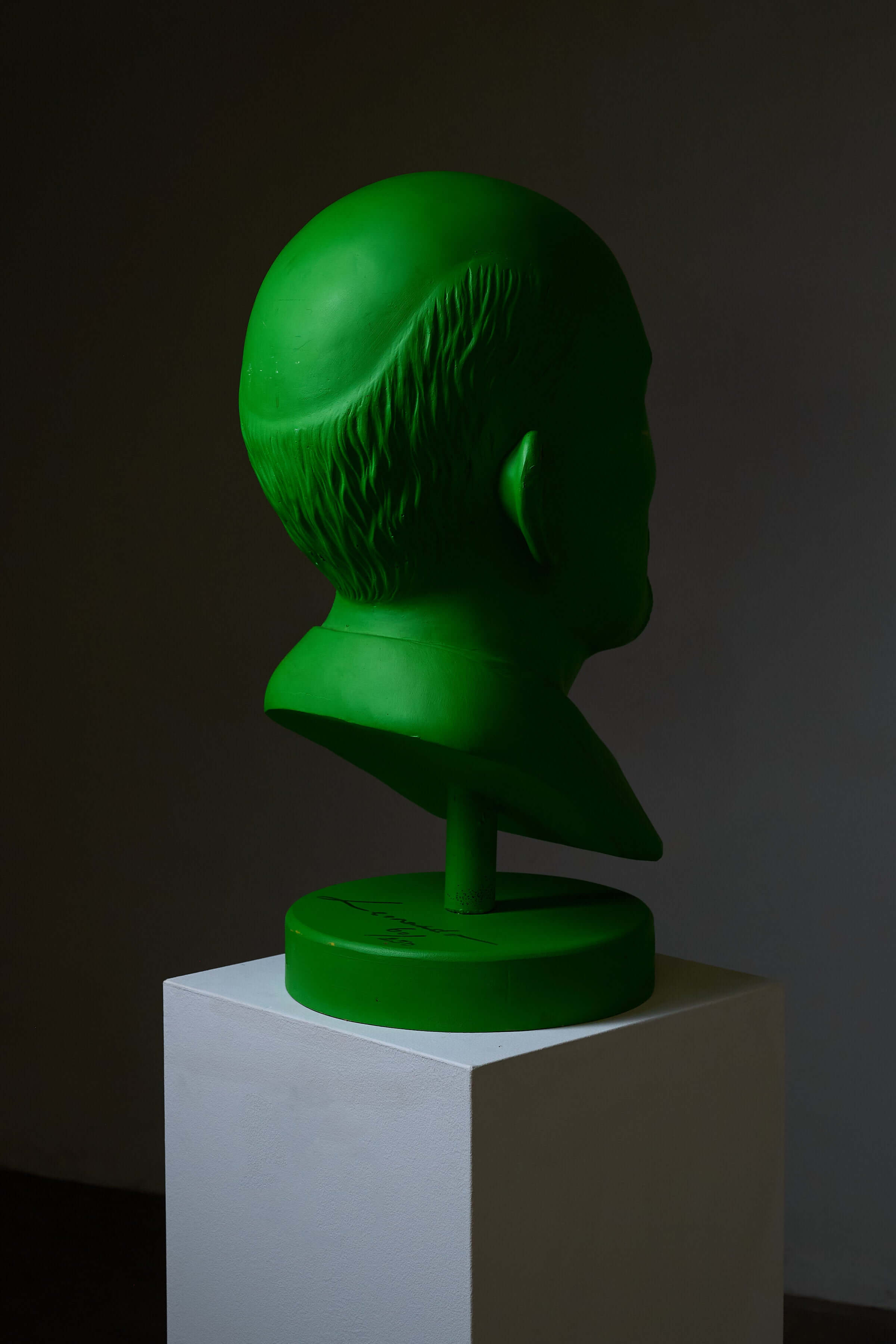 Vladimir Lenin Sculpture by Leonardo in vibrant green, displayed on a pedestal, showcasing unique artistic design.