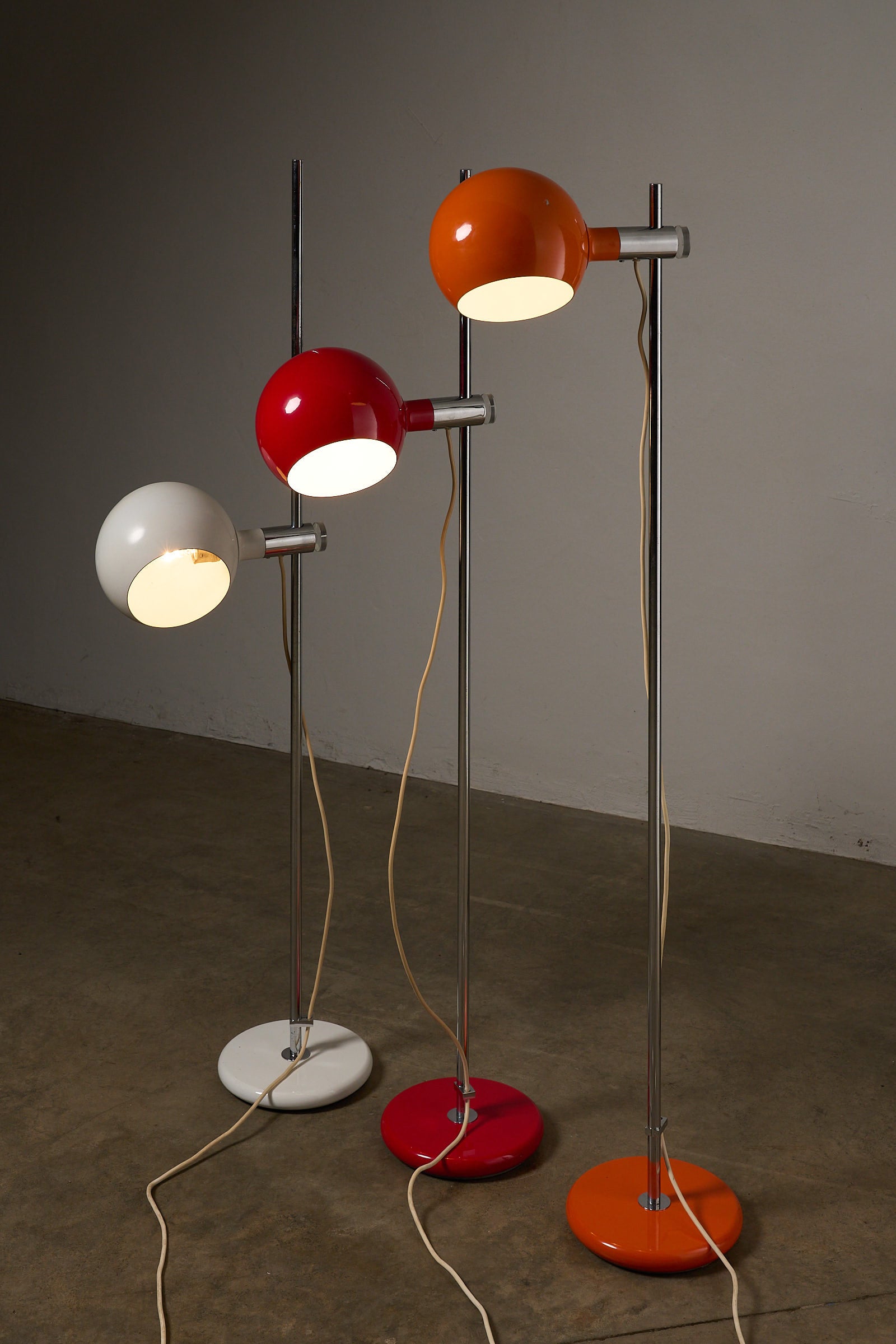 Orange Sphere Floor Lamp with Diffuser and other colorful floor lamps in a stylish interior setting.